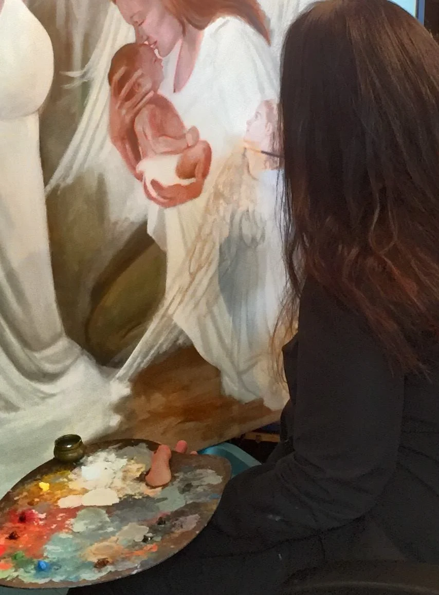 Heather Collins painting a commissioned oil portrait in her Space Coast, Florida studio